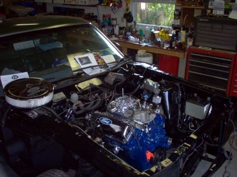 1970 Ford Ranchero - Engine bay of a 1970 Ford Ranchero, a blue Ford V8 engine and chrome air cleaner.
