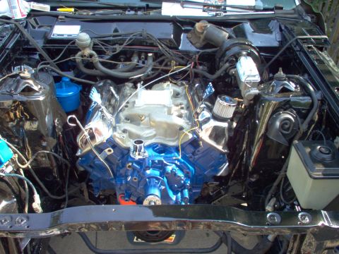 1970 Ford Ranchero - Engine bay detail showing a V8 engine with blue block and chrome accents.