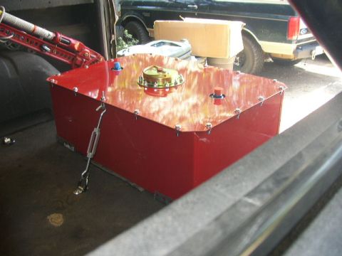 1995 Ford Bronco - Aftermarket fuel tank installed in a vehicle, with another vehicle visible in the background.