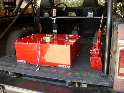 1995 Ford Bronco - Interior view of a 1978 Ford Bronco, modified with a large red fuel tank and racing seats.