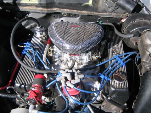 1969 Ford Ranchero - Close-up view of a V8 engine, highlighting the air intake and valve covers.