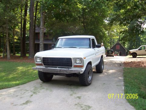 1979 Ford Bronco - This white pickup truck is seen from the front on a driveway. The date 07/17/2005 is visible in the lower right corner.