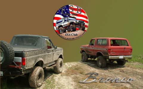 1988 Ford Bronco - Two Ford Broncos, one black and one red, parked on a dirt trail.