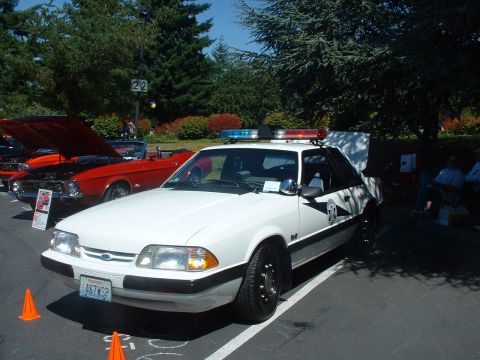 1999 Ford Crown Victoria - Friend's restored '87 Washington State Patrol Mustang.