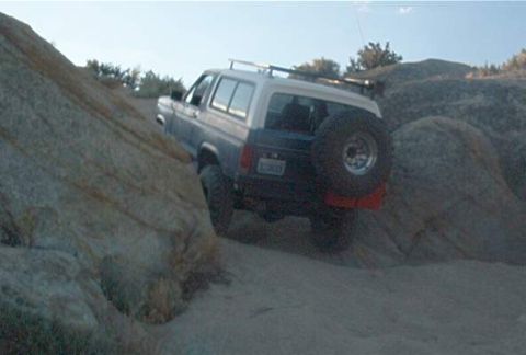 1986 Ford Bronco - This 1986 Ford Bronco navigates a rocky desert trail, its off-road capability.