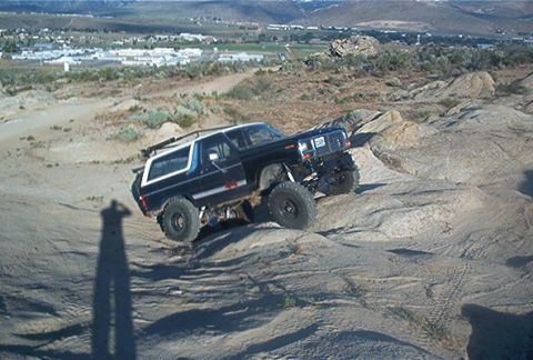 1986 Ford Bronco - Ford Bronco navigates a challenging rocky off-road course.