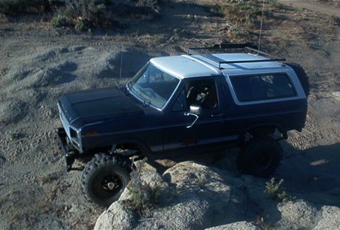 1986 Ford Bronco - This Ford Bronco appears to be from the early 1980s, not 1986, as it navigates a rocky trail.