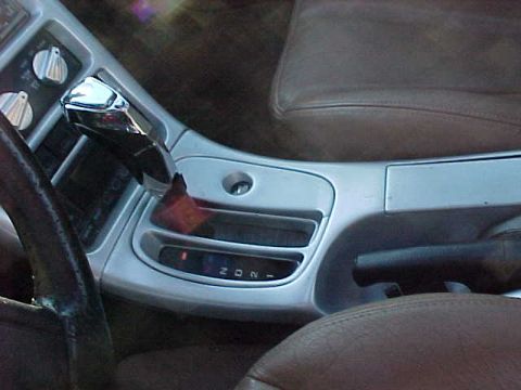 1993 Ford Probe - Interior view of a 1993 Ford Probe, focusing on the center console and gear shifter.