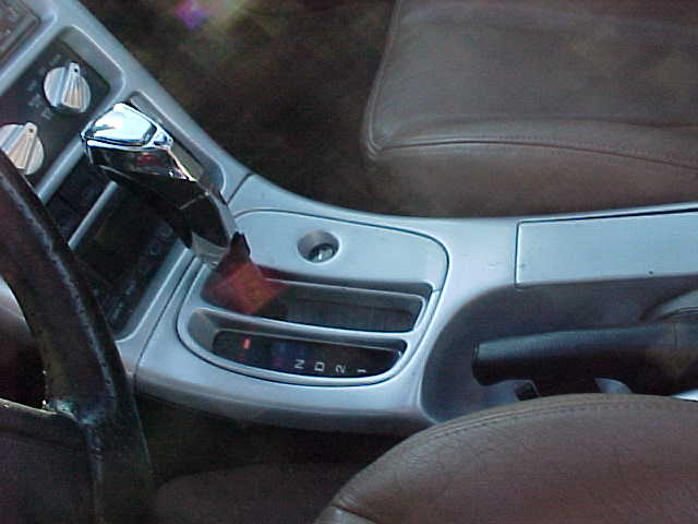 1993 Ford Probe interior showing gear shifter, dashboard controls, and leather seat