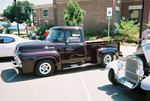 1972 Ford Ranchero - A classic Ford pickup truck is parked at an outdoor event, with other vehicles nearby.