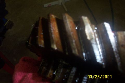 1979 Ford F-150 - A gear with oil on its teeth is shown, dated 03/25/2001.