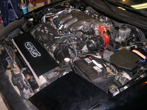 1997 Ford Probe - The engine bay features a custom GTS air intake system and various engine components.