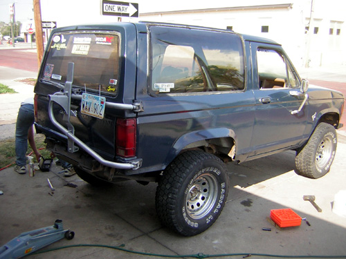 Dark blue 1986 Ford Bronco II rear quarter view with spare tire carrier