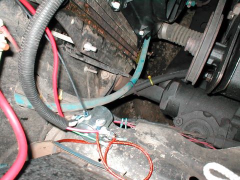 1979 Ford Bronco - This image shows various engine bay components, including hoses and wiring, without clear identification of the vehicle model or year.