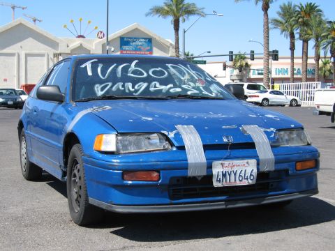 2003 BMW Z4 - This blue Honda CRX has custom writing on its windshield and duct tape repairs on the front.