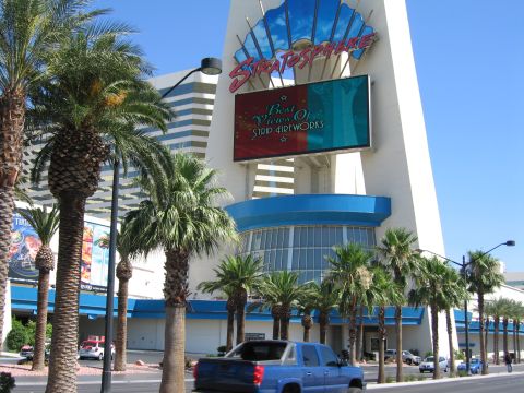 2003 BMW Z4 - A blue pickup truck is seen from behind on a street with palm trees and the Stratosphere hotel in the background.