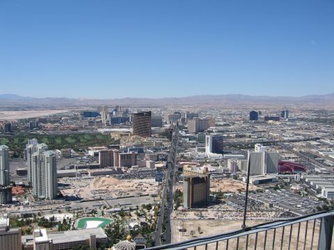 2003 BMW Z4 - A wide view of the Las Vegas Strip shows numerous hotels and casinos under a clear blue sky.