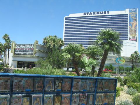 2003 BMW Z4 - A red car is visible in the distance, parked near the Stardust hotel and casino.