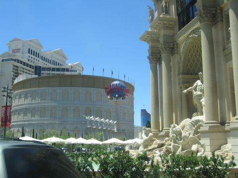 2003 BMW Z4 - A view of Planet Hollywood Las Vegas, with Caesar's Palace visible in the distance and a statue fountain in the foreground.