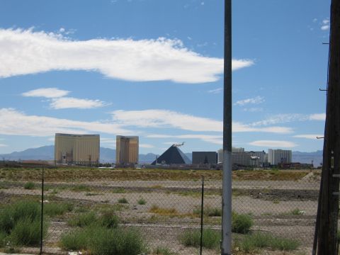 2003 BMW Z4 - A view of the Las Vegas Strip, including the Luxor Pyramid and other hotels, under a partly cloudy sky.