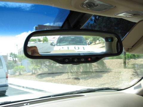2003 BMW Z4 - View of a white SUV through the interior rearview mirror, with partial text '101' visible on its hood.