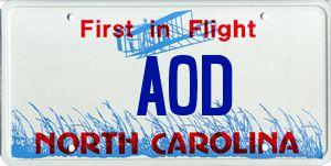 1985 Ford LTD Crown Victoria - A North Carolina license plate the 'First in Flight' slogan and 'AOD' designation.