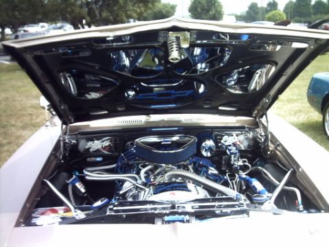 1995 Ford Probe - Customized engine bay with polished components and blue detailing is displayed with the hood open.