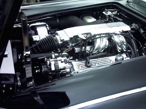 Engine bay with chrome valve covers, intake manifold, and alternator