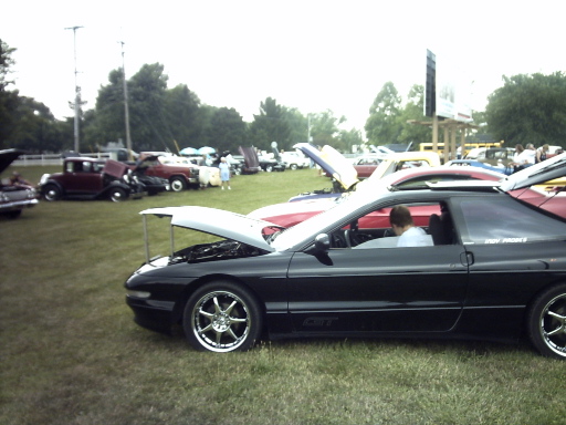 1995 Ford Probe, black, 3/4 front view, hood open, at car show