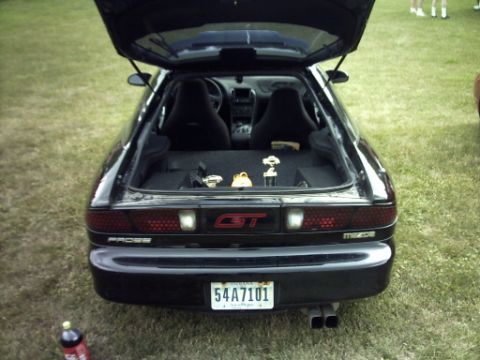 1995 Ford Probe - This Mazda MX-6 GT has its trunk open, displaying trophies and a subwoofer in the cargo area.