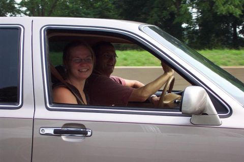 1985 Ford LTD Crown Victoria - A man and woman smile while riding in a 1985 Ford Crown Victoria LTD.