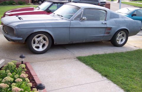 1999 Mitsubishi Mirage - This 1967 Ford Mustang coupe is in primer and appears to be undergoing restoration.