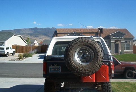 1986 Ford Bronco - This 1987 Ford Bronco is equipped with a rear-mounted spare tire and two red jerrycans.