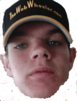 1990 Ford Bronco - young man faces the camera in a vignette portrait wearing a dark TheWebWheeler.com baseball cap.