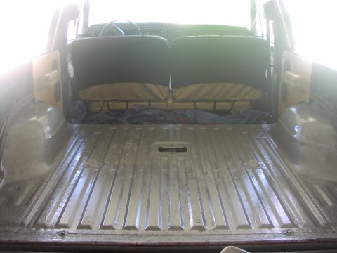 1979 Ford Bronco - The cargo area of a 1978 Ford Bronco shows ribbed metal flooring and two rows of seats.
