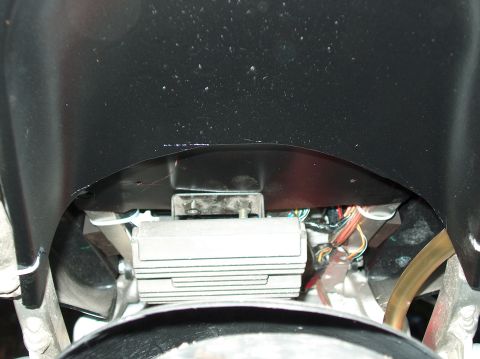 2002 Suzuki TL1000R - Close-up view of a motorcycle's electrical components, including a control unit and wiring harness.