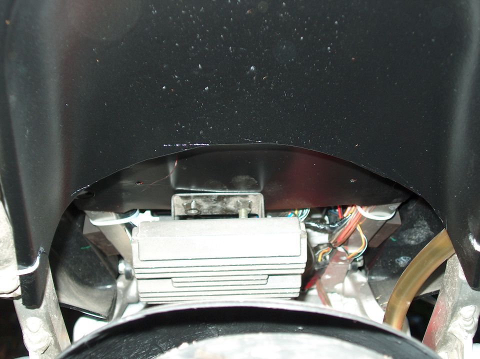 Motorcycle electrical control unit with wires and a yellow hose