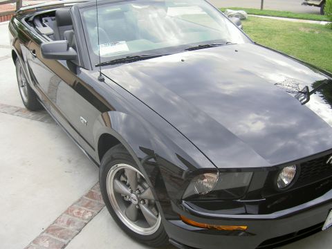 2005 Ford Mustang - A black 2005 Ford Mustang convertible is shown from a 3q front angle.