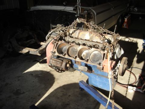1963 Ford Galaxie - Engine removed from a vehicle and placed on an engine stand for repair or restoration.