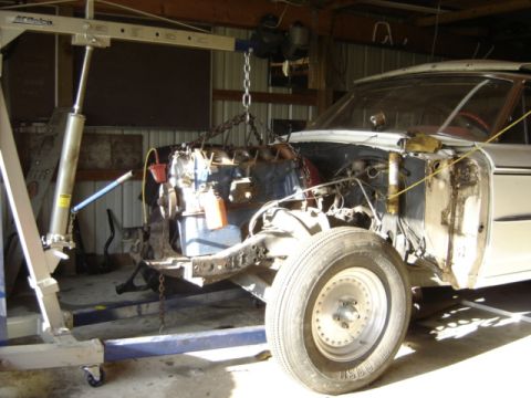 1963 Ford Galaxie - Engine removal in progress on a 1963 Ford Galaxie, indicating a restoration project.