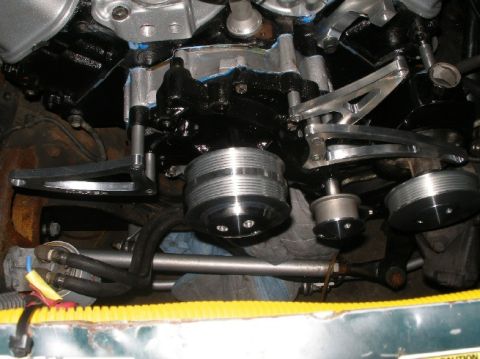 1994 Ford Bronco - Close-up view of engine pulleys and custom aluminum brackets.