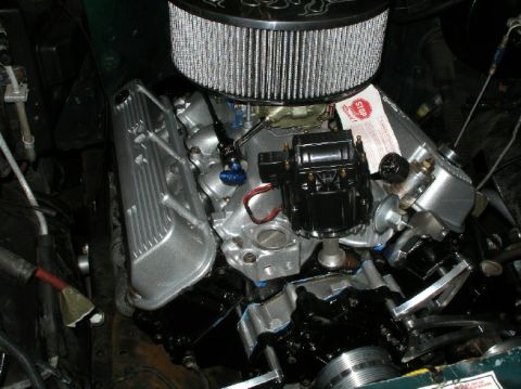 1994 Ford Bronco - The engine bay shows a V8 motor with aftermarket parts and a prominent air filter assembly.
