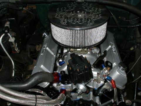 1994 Ford Bronco - Custom engine bay components including air cleaner, valve covers, and braided fuel lines are visible.