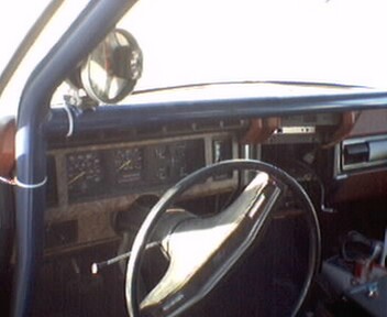 1981 Ford Bronco - The interior of a vehicle is shown, focusing on the dashboard, steering wheel, and instrument cluster.