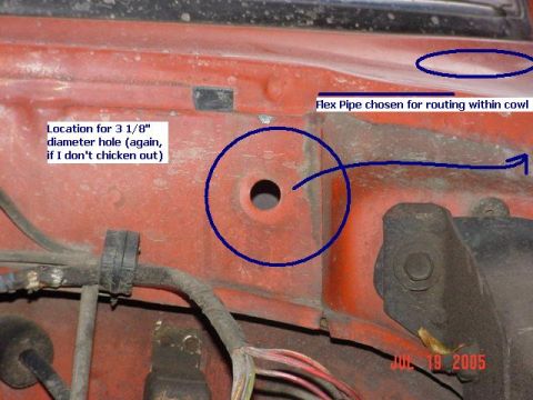 1978 Ford Bronco - A hole is being drilled in the vehicle's firewall for routing a flex pipe, as marked in the photo.
