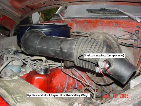1978 Ford Bronco - Custom air intake modification with temporary capping using zip ties and duct tape.