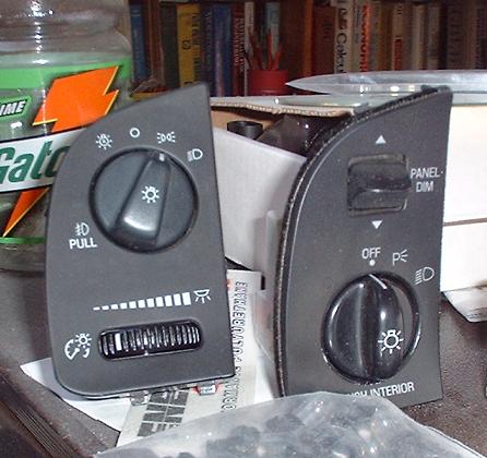 1997 Ford Crown Victoria - Two automotive switch assemblies are shown, one for headlights and one for panel dimming.