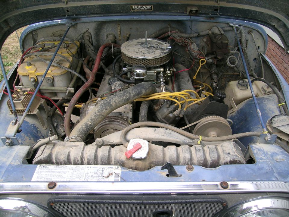 Engine bay with chrome air cleaner, V8, yellow plug wires and Mopar Performance hood decal