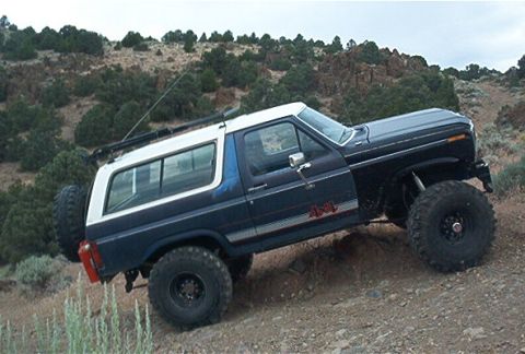 1986 Ford Bronco - This modified Ford Bronco navigates a rocky, off-road terrain.