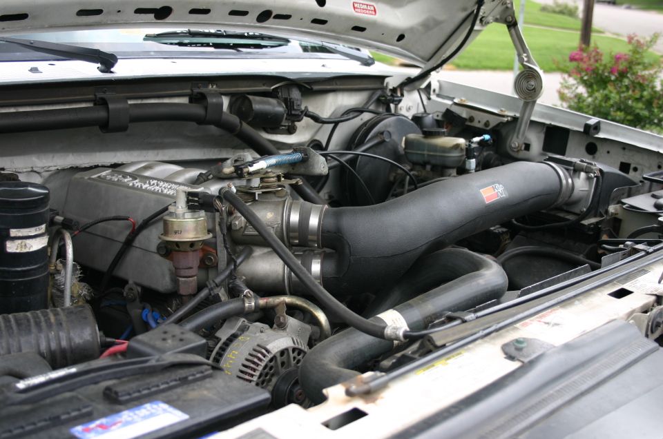 Ford EFI V8 engine bay with black aftermarket cold-air intake tube